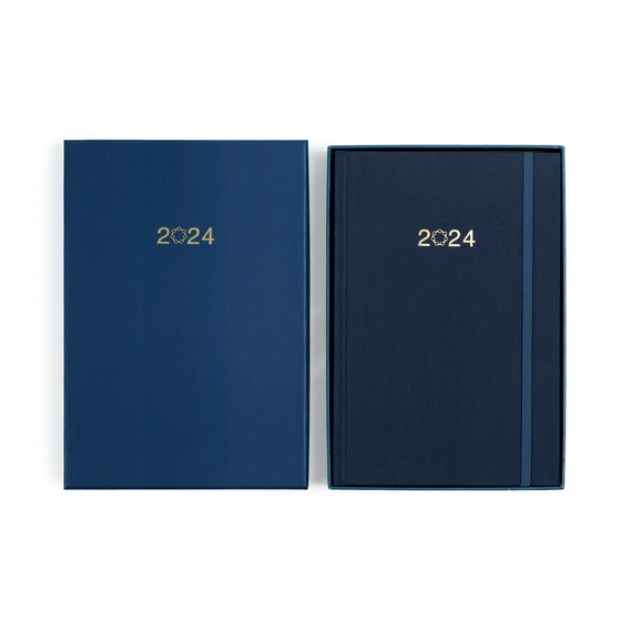 A photo showing the matching box that the planners come in from the top - embossed with 2024 like the cover