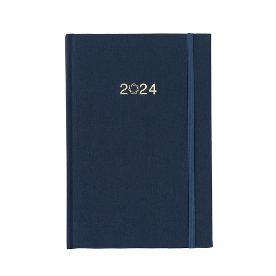 A beautiful navy linen planner with 2024 on the cover and a matching navy elastic closure