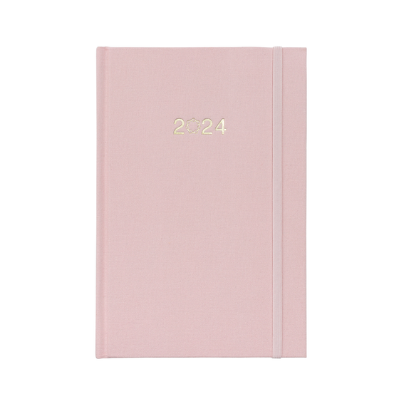 A beautiful pink linen planner with 2024 on the cover and a matching pink elastic closure